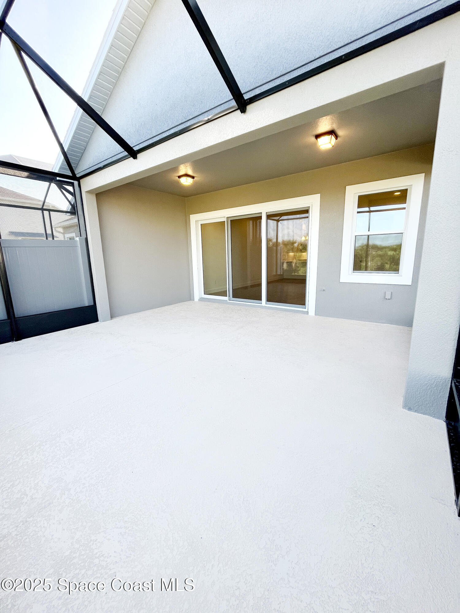 7707 Cache Crk Lane Melbourne, FL 32940 - Photo 17 of 18 a view of an empty room with a window