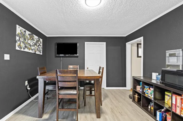 a view of a livingroom with furniture and a flat screen tv
