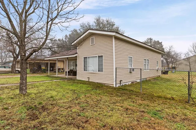a house view with a garden space