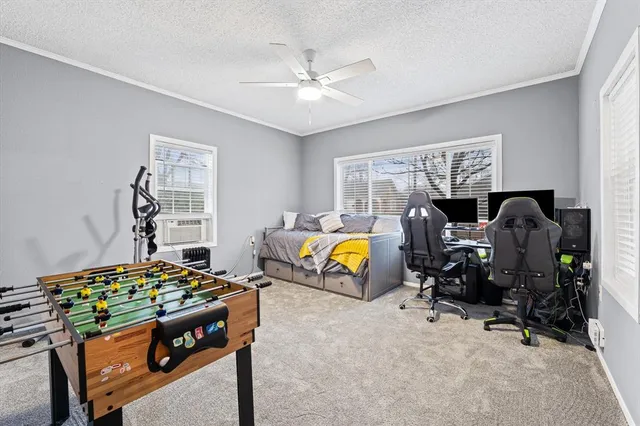 a bedroom with bed and a window