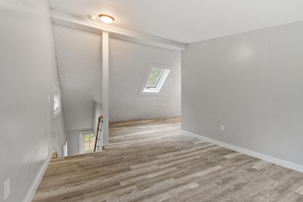 258 Allen Road Ashby, MA 01431 - Photo 23 of 36 a view of an empty room with wooden floor and a window