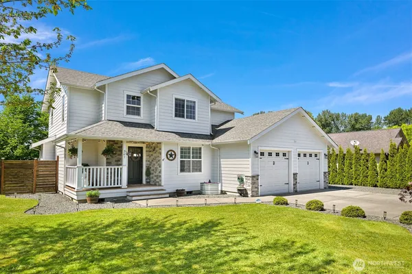 a view of a house with swimming pool and sitting area