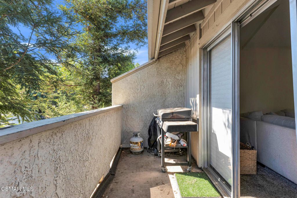 1932 Heywood Street, Unit B Simi Valley, CA 93065 - Photo 17 of 28 a view of balcony with chair and a potted plant
