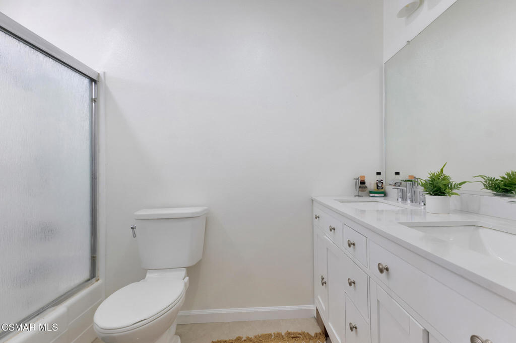 1932 Heywood Street, Unit B Simi Valley, CA 93065 - Photo 8 of 28 a white toilet sitting next to a bathroom sink