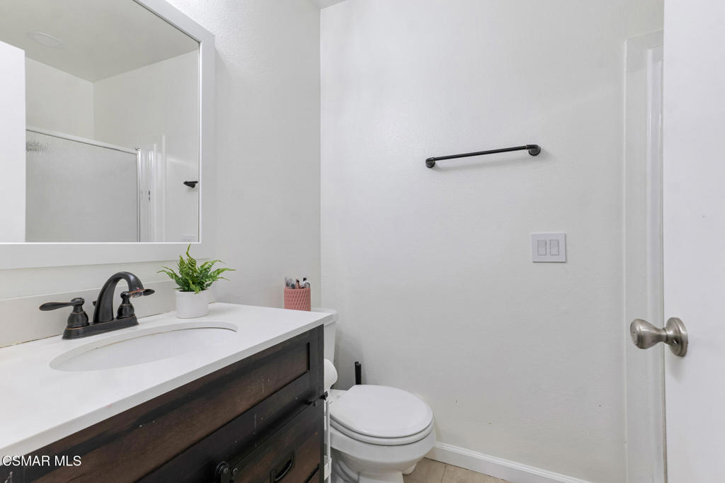 1932 Heywood Street, Unit B Simi Valley, CA 93065 - Photo 10 of 28 a bathroom with a sink a toilet a mirror and shower