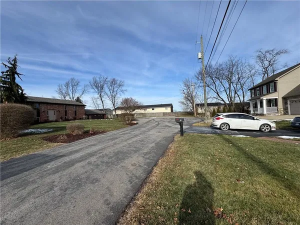 a view of street with parked cars