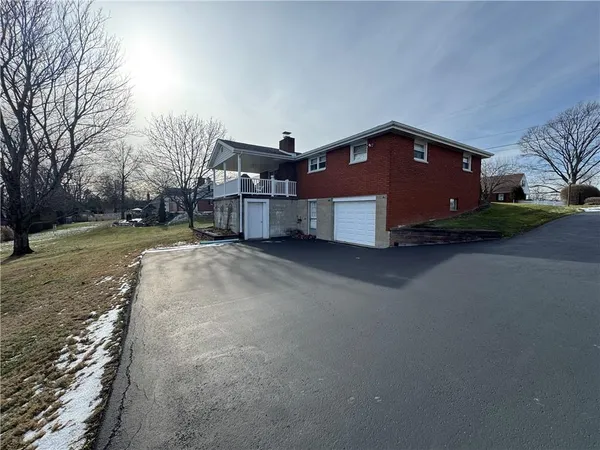 a house view with a big yard