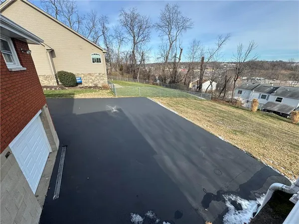 a view of a backyard of the house
