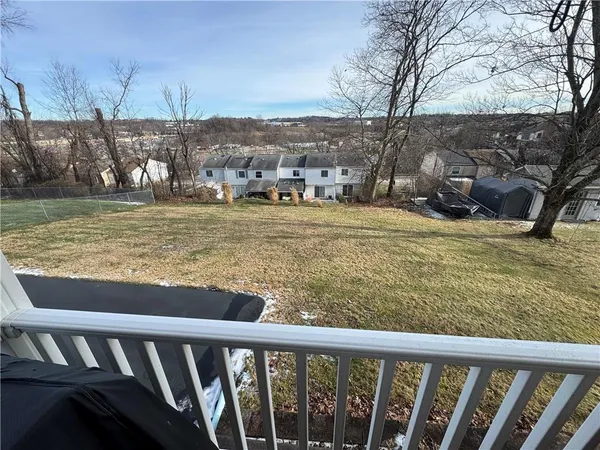 a view of a balcony with an outdoor space