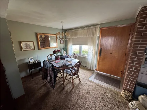 a view of a livingroom with furniture and window