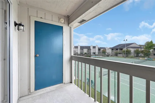 a view of a street from a balcony