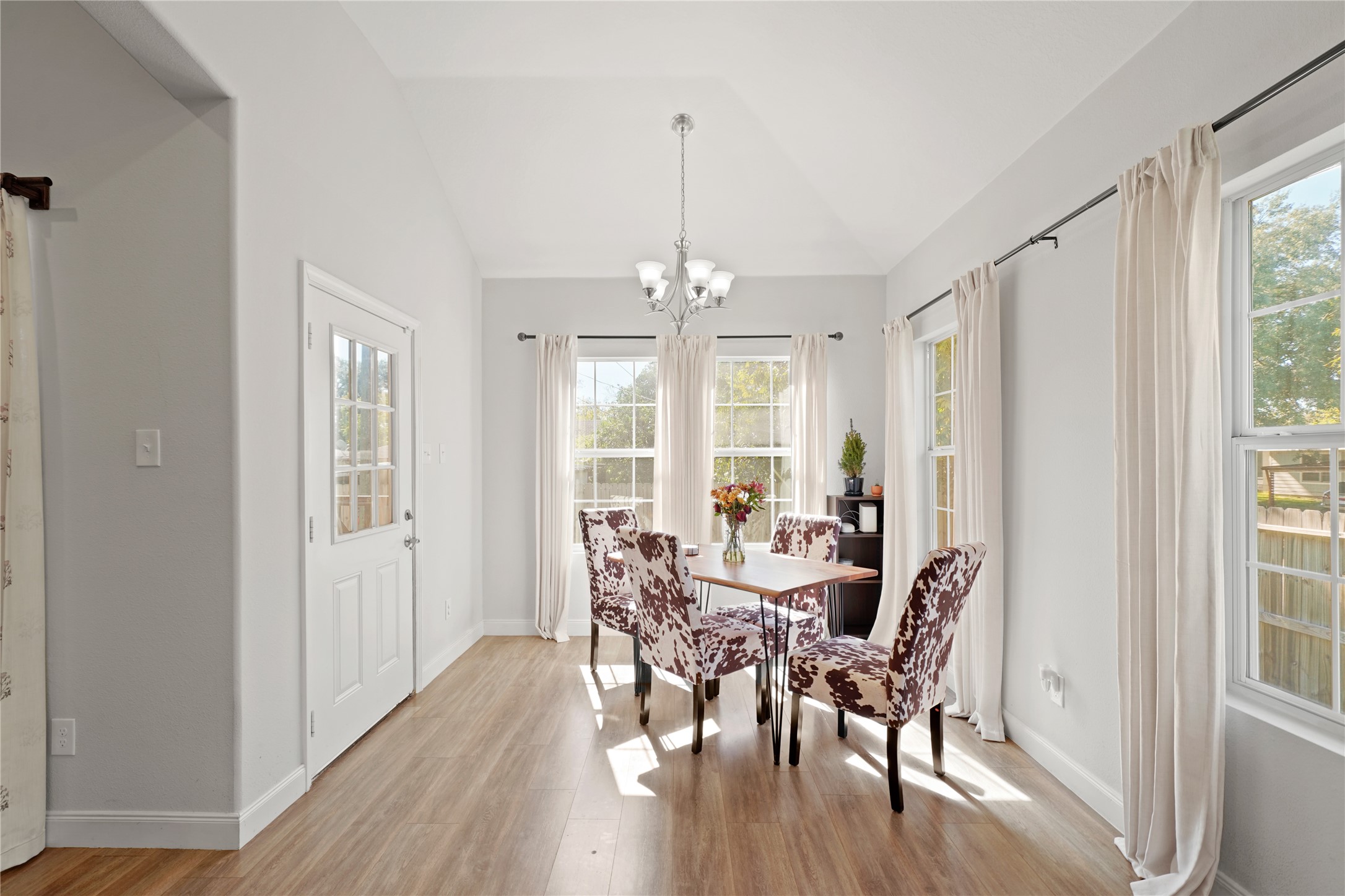 5602 Belmark Street Houston, TX 77033 - Photo 14 of 27 a view of a dining room with furniture window and wooden floor