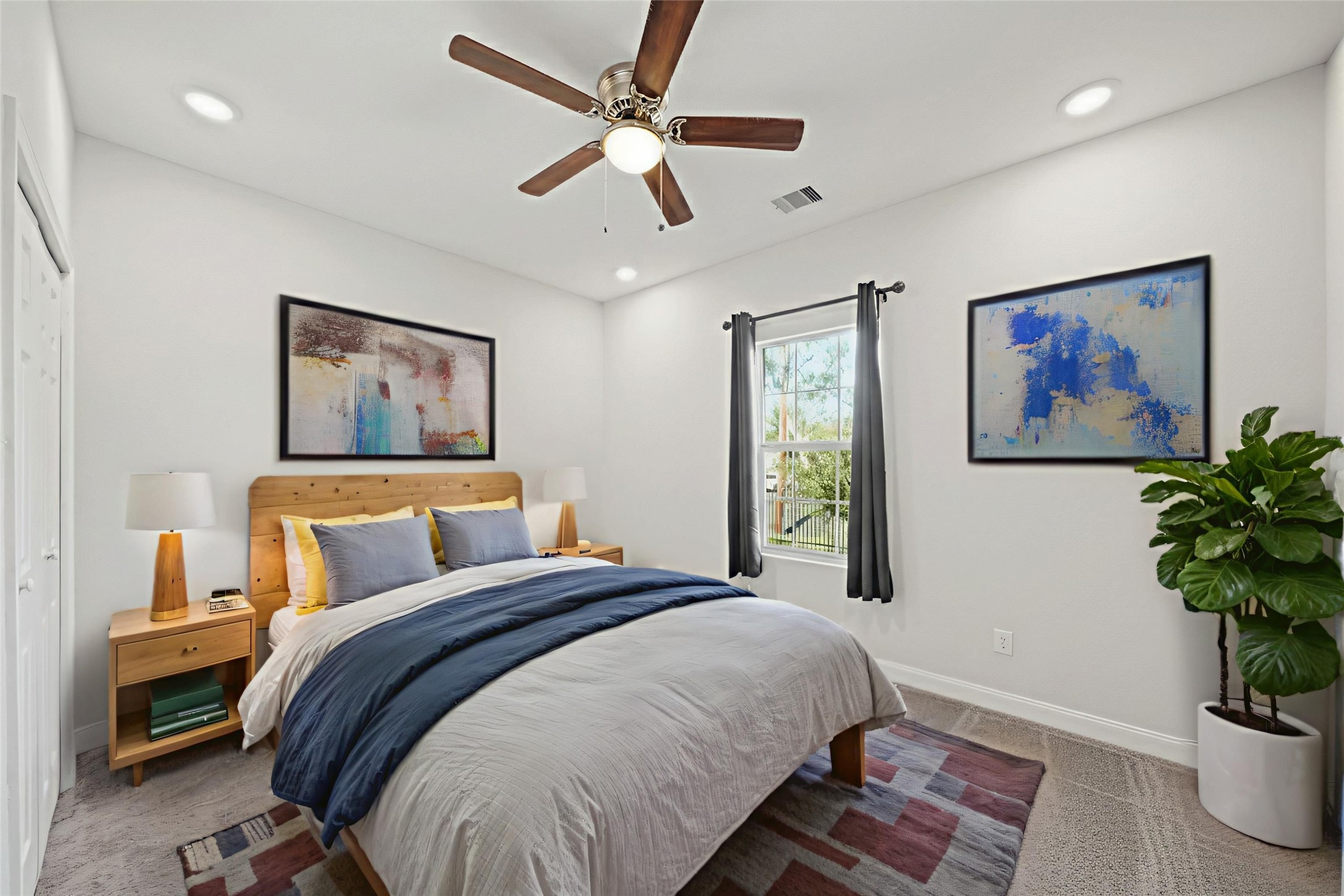 5602 Belmark Street Houston, TX 77033 - Photo 21 of 27 a bed room with a bed and a painting on the wall
