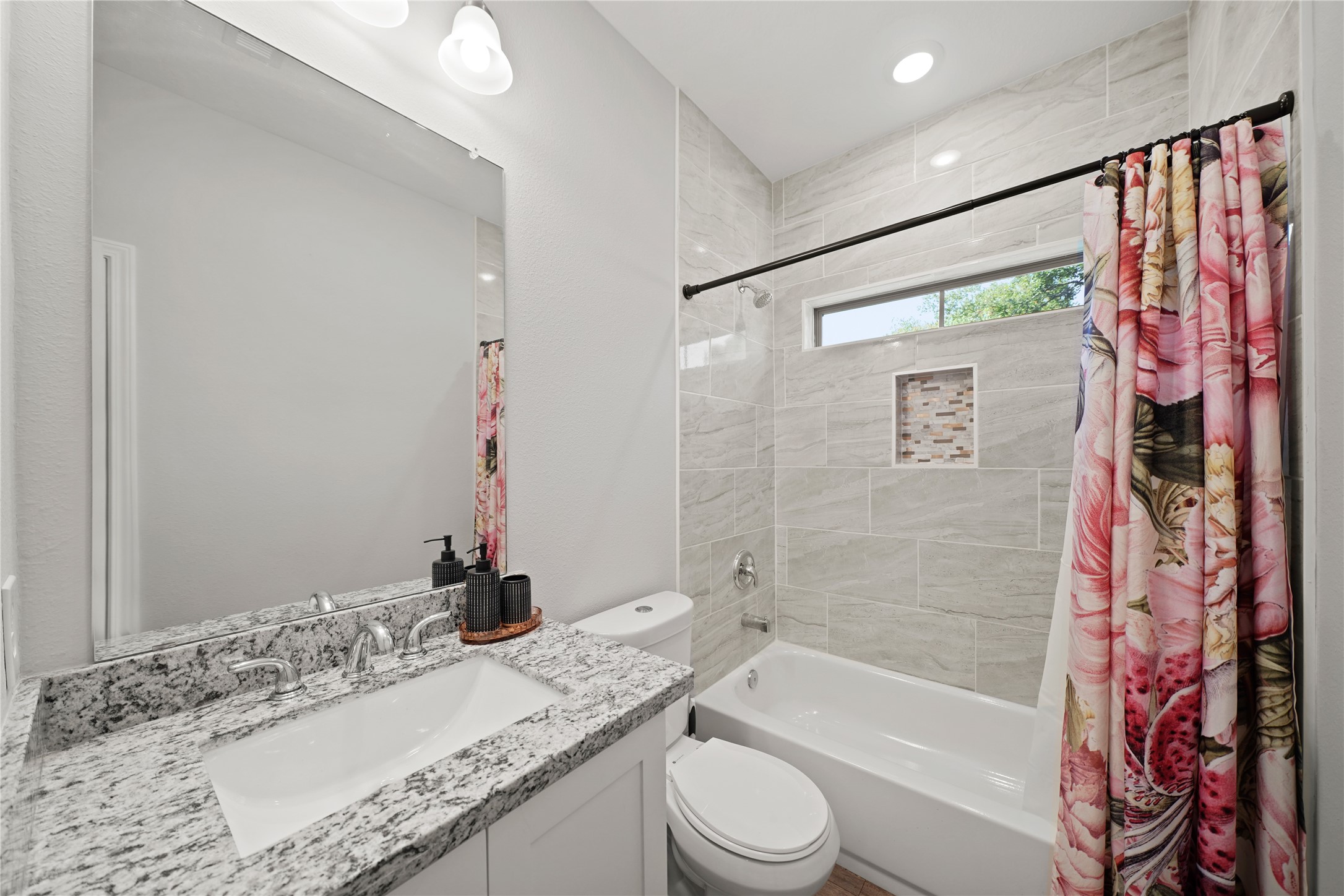 5602 Belmark Street Houston, TX 77033 - Photo 22 of 27 a bathroom with a granite countertop sink toilet and shower