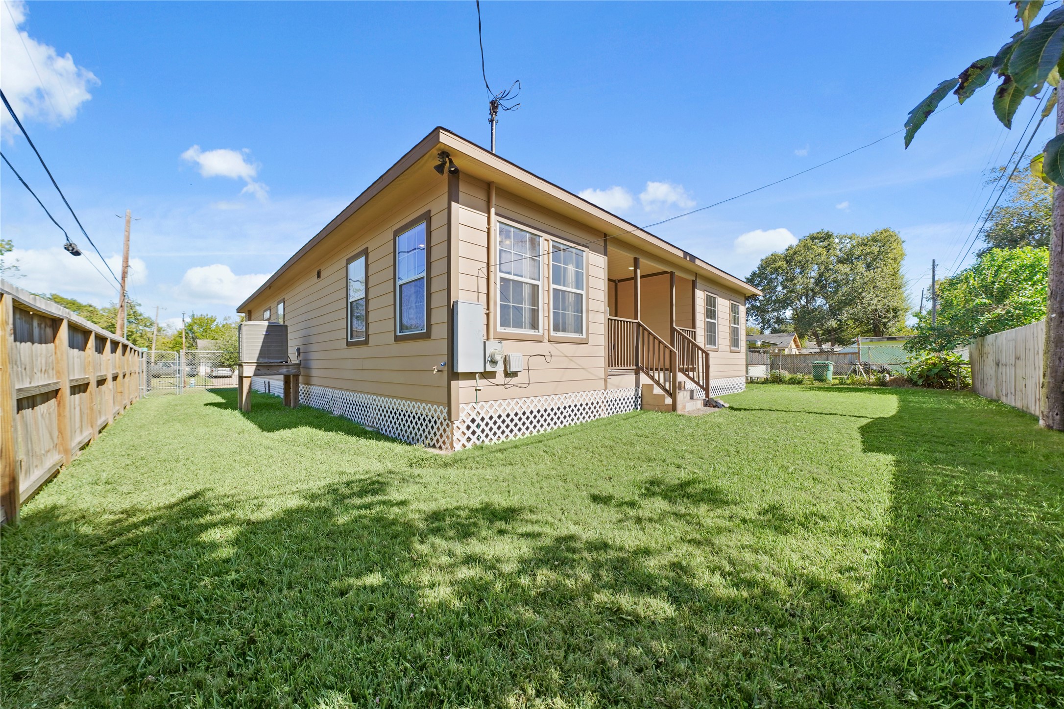 5602 Belmark Street Houston, TX 77033 - Photo 25 of 27 a view of a house with a yard