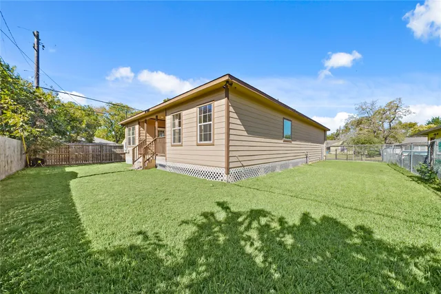 a view of a backyard of the house