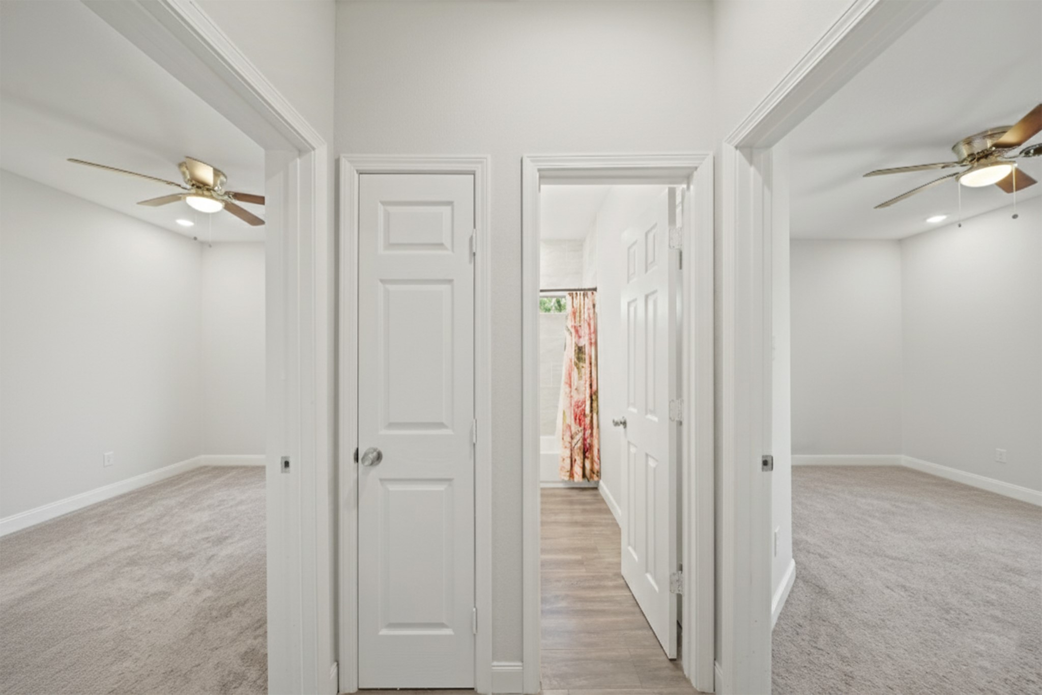 5602 Belmark Street Houston, TX 77033 - Photo 5 of 27 a view of a hallway with a chandelier fan