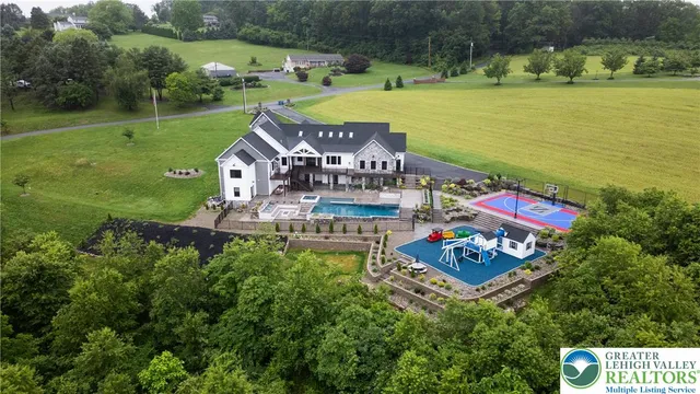 a kitchen with stainless steel appliances a stove and white cabinets