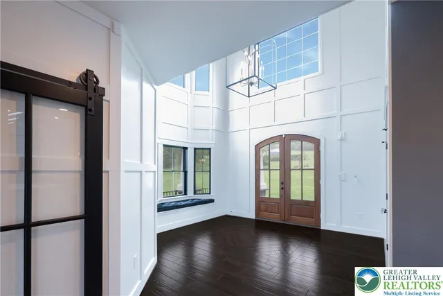 a large bedroom with a bed and a fireplace