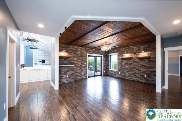 a kitchen with stainless steel appliances a stove refrigerator and cabinets