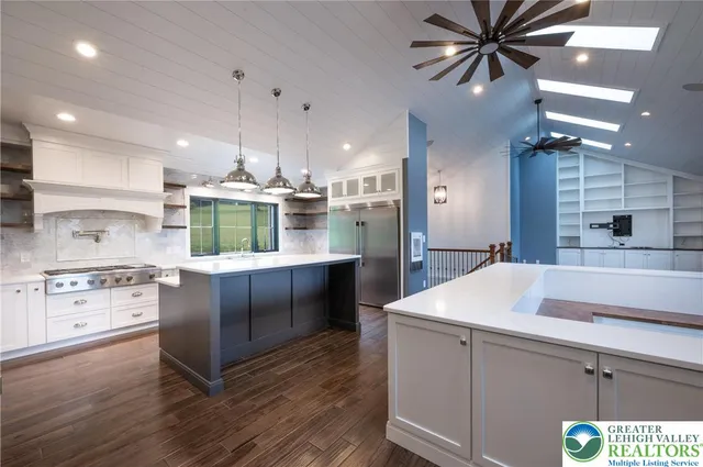 a large bathroom with a large tub and sink