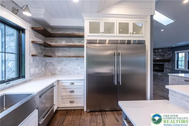 a bathroom with a tub and shower