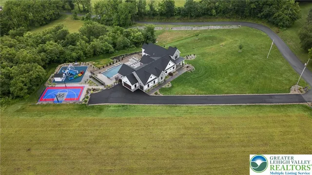 an aerial view of residential houses with outdoor space