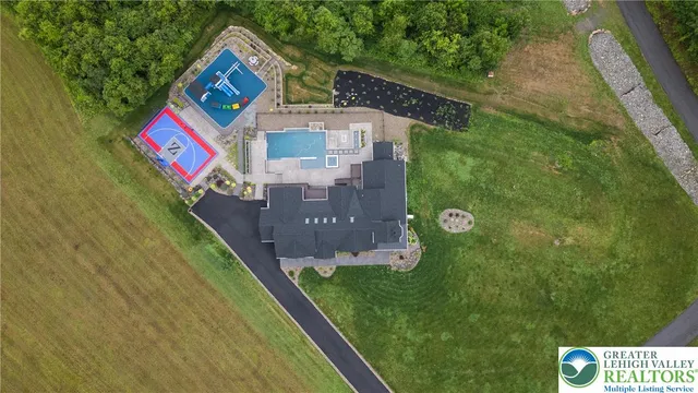 an aerial view of a house with a garden