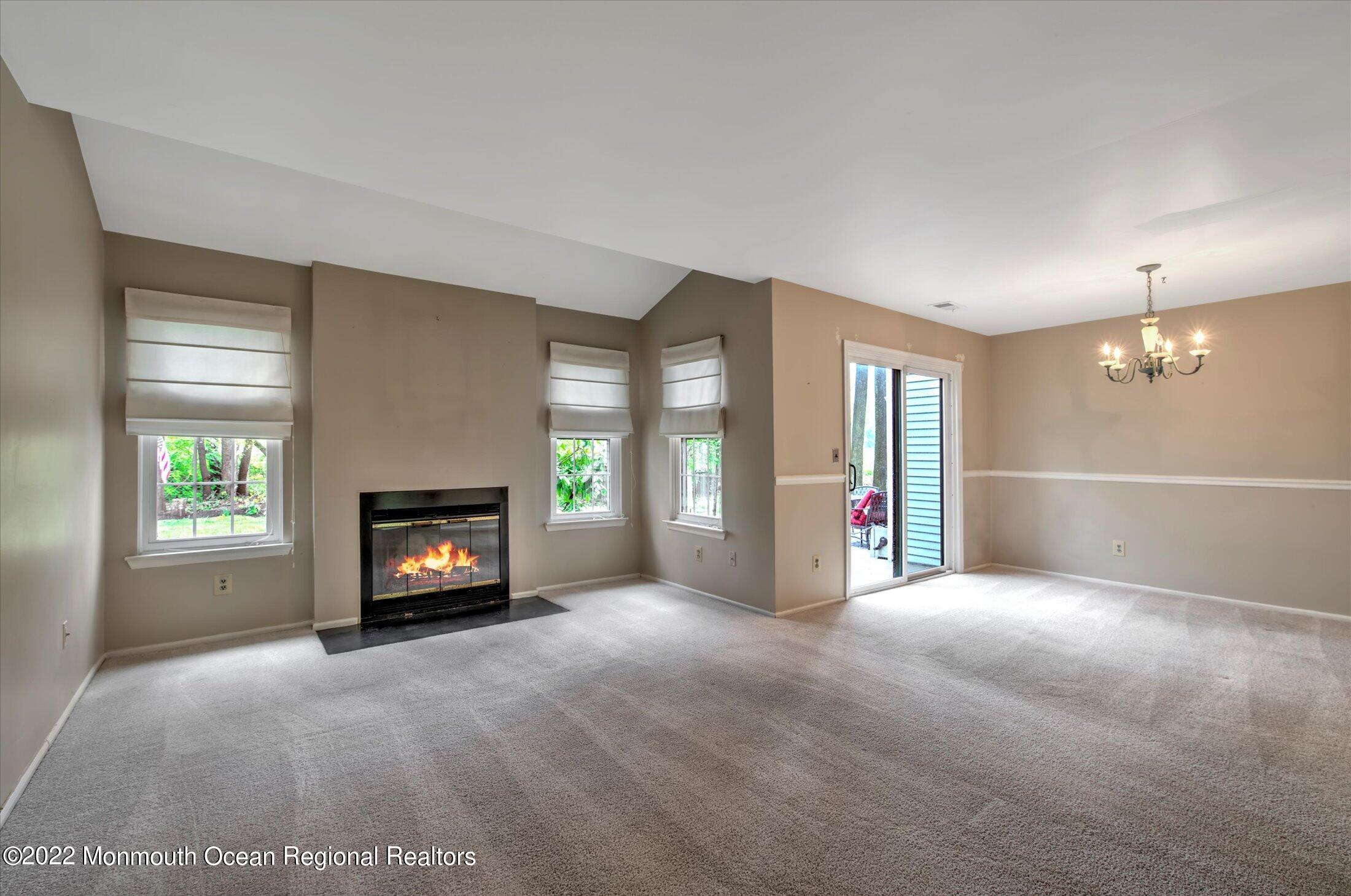 10 Hunters Oceanport, NJ 07757 - Photo 2 of 7 a view of an empty room with a window and fireplace