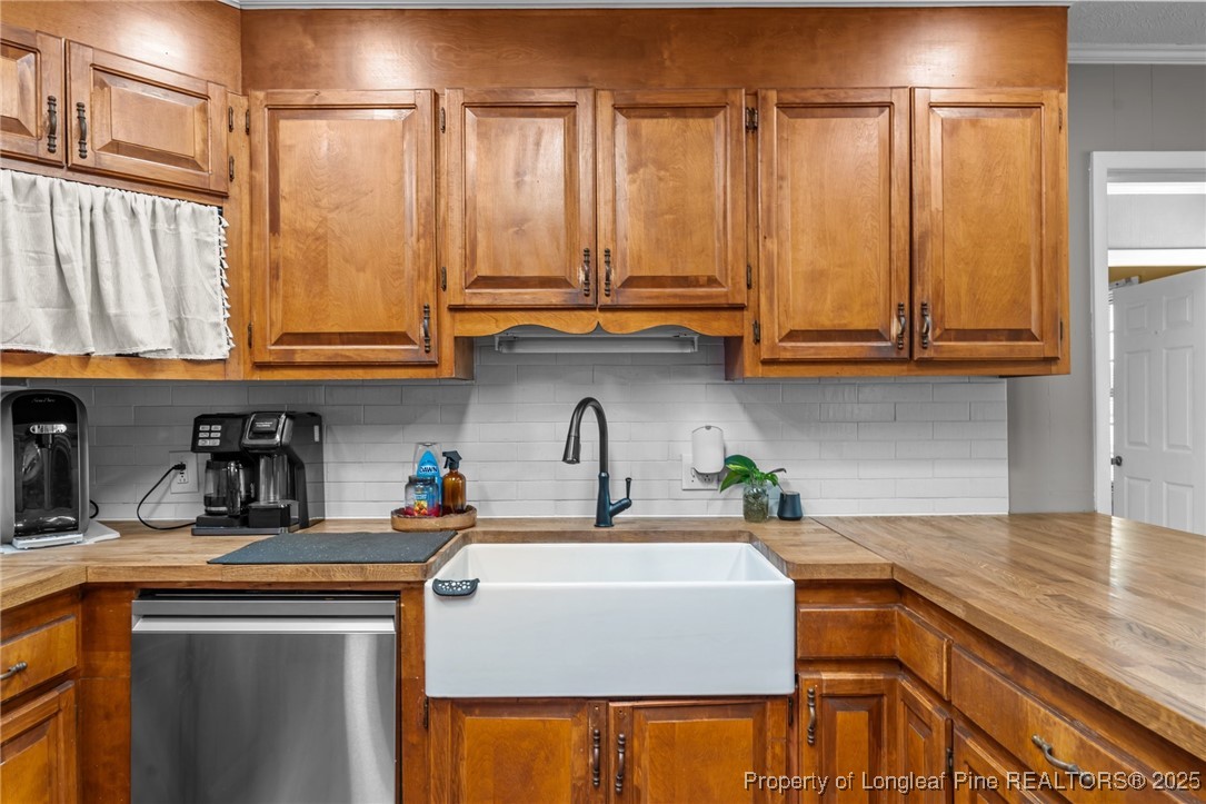 1284 Old Stage Road Fairmont, NC 28340 - Photo 19 of 48 a kitchen with stainless steel appliances granite countertop a sink a stove and cabinets