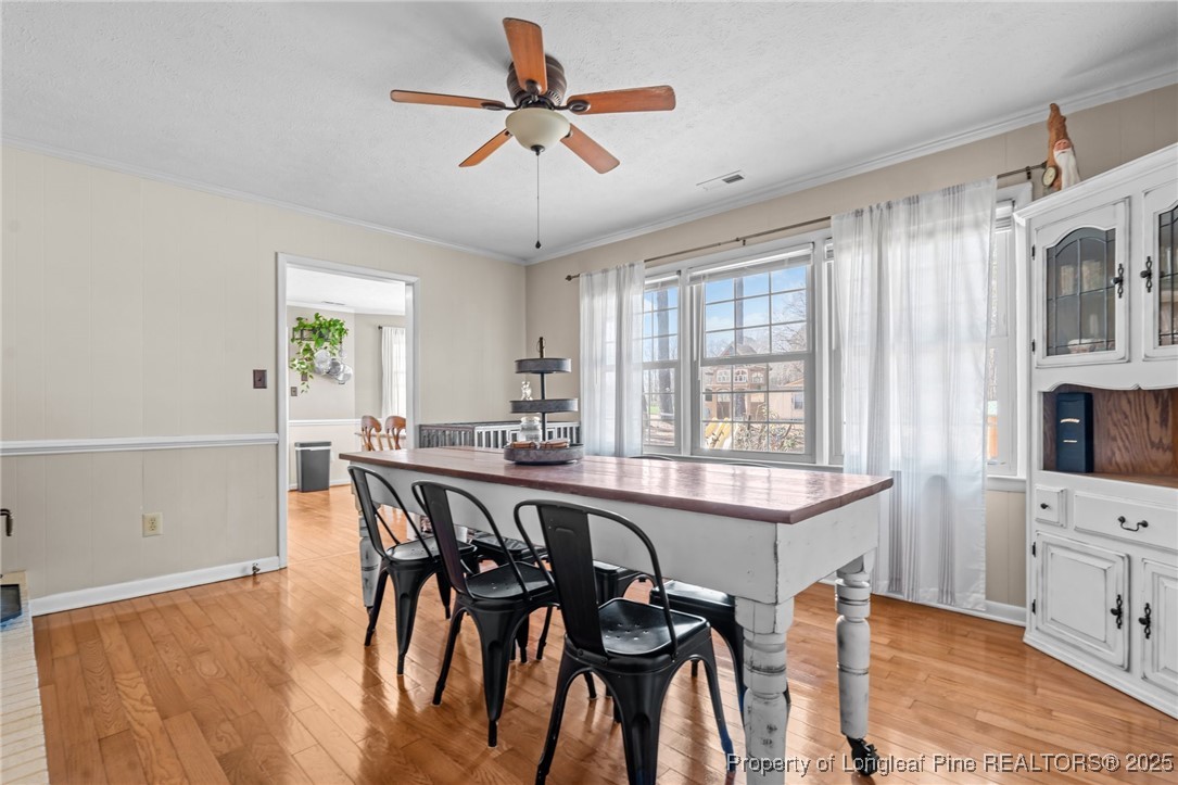 1284 Old Stage Road Fairmont, NC 28340 - Photo 21 of 48 a view of a dining room with furniture and window