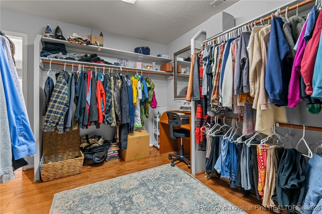 1284 Old Stage Road Fairmont, NC 28340 - Photo 28 of 48 a view of walk in closet with clothes