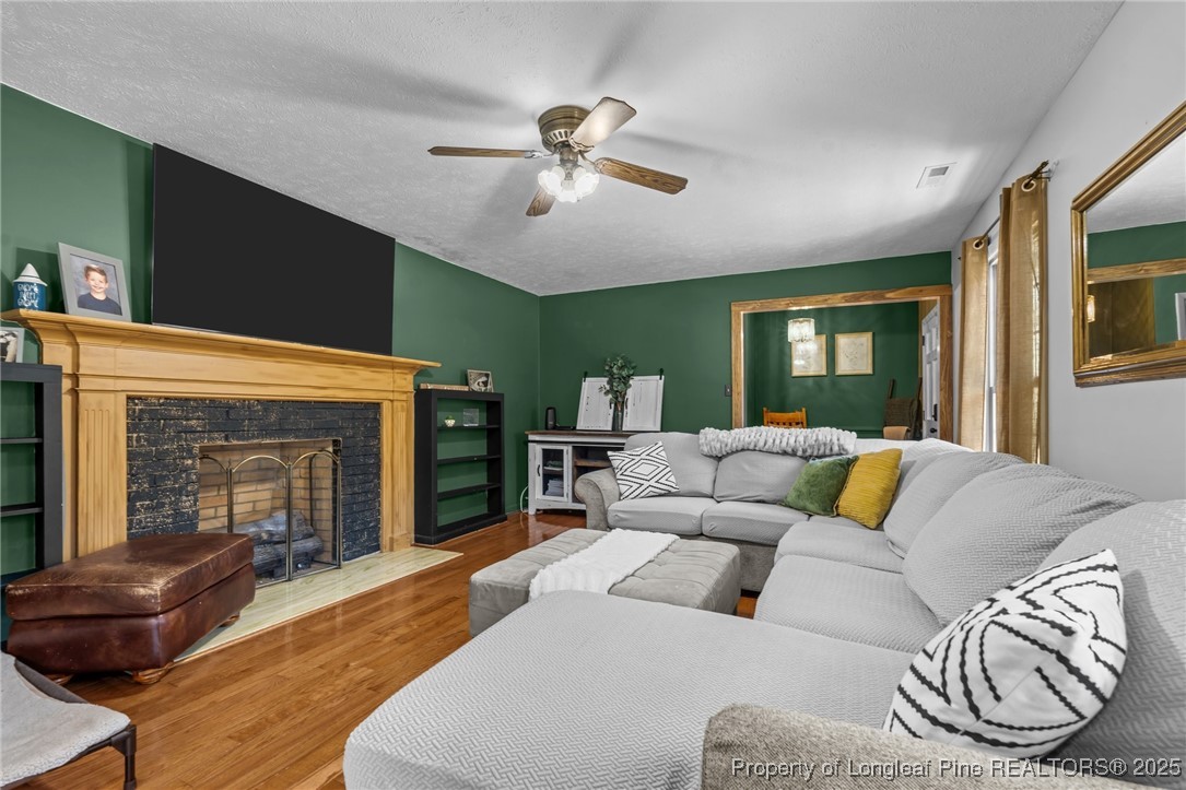 1284 Old Stage Road Fairmont, NC 28340 - Photo 7 of 48 a living room with furniture and a fireplace