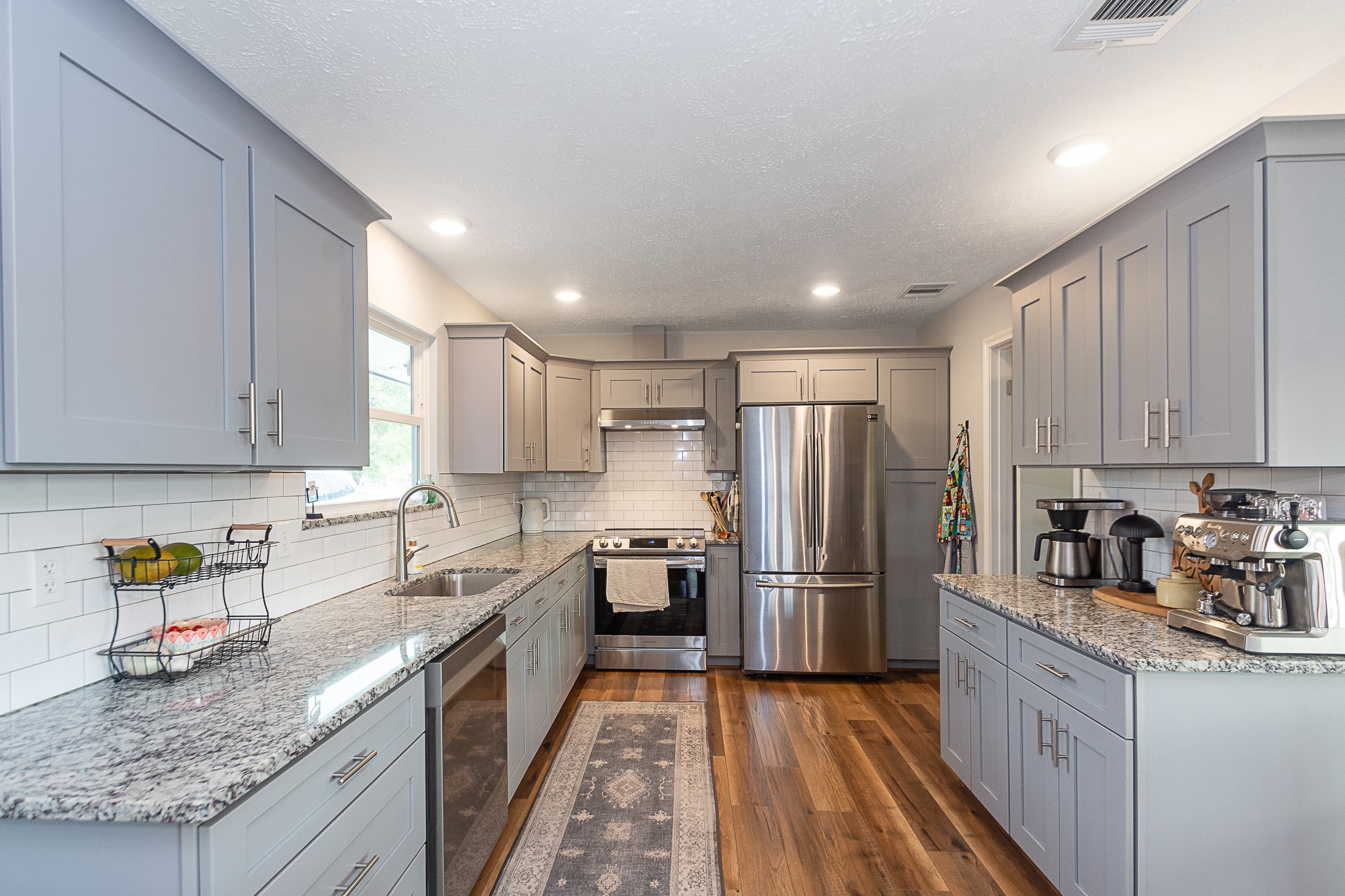 The kitchen has been completely remodeled, with plenty of counterspace, gorgeous cabinetry, and a brand new stone, this is the one!!!