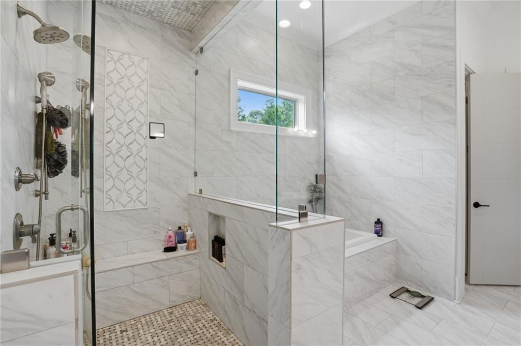 3020 Wallace Road Buford, GA 30519 - Photo 30 of 66 a bathroom with a bathtub and shower