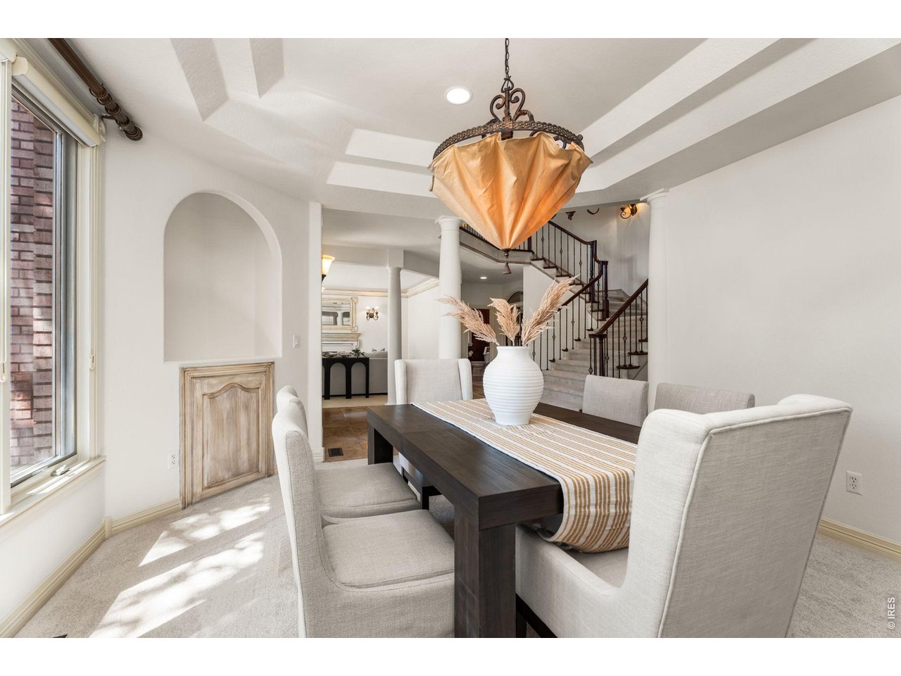 5100 Abbey Road Fort Collins, CO 80526 - Photo 11 of 49 a view of dining room and livingroom with furniture wooden floor a chandelier