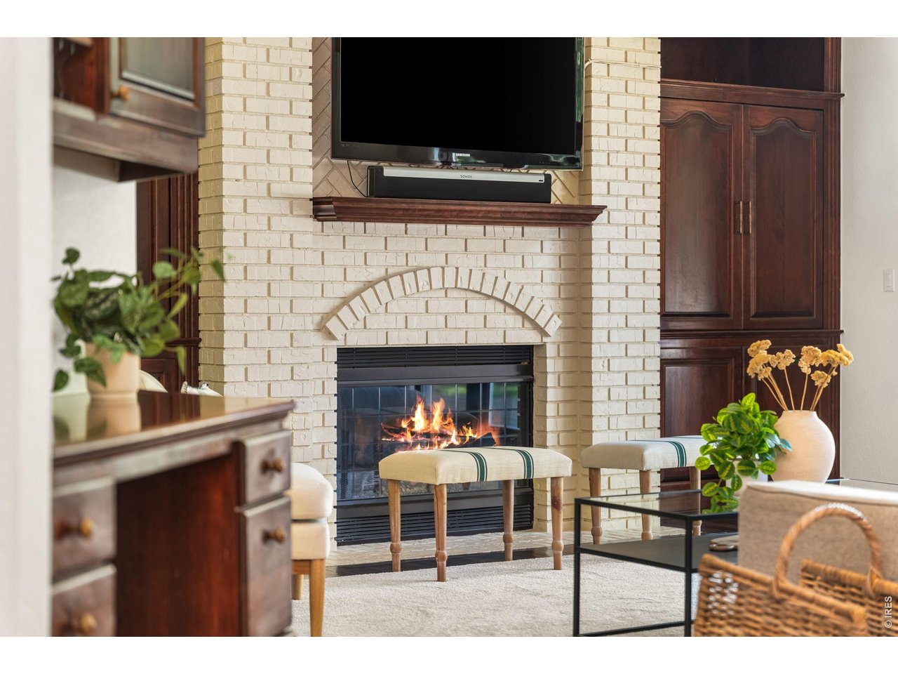 5100 Abbey Road Fort Collins, CO 80526 - Photo 13 of 49 a living room with furniture a fireplace and a flat screen tv