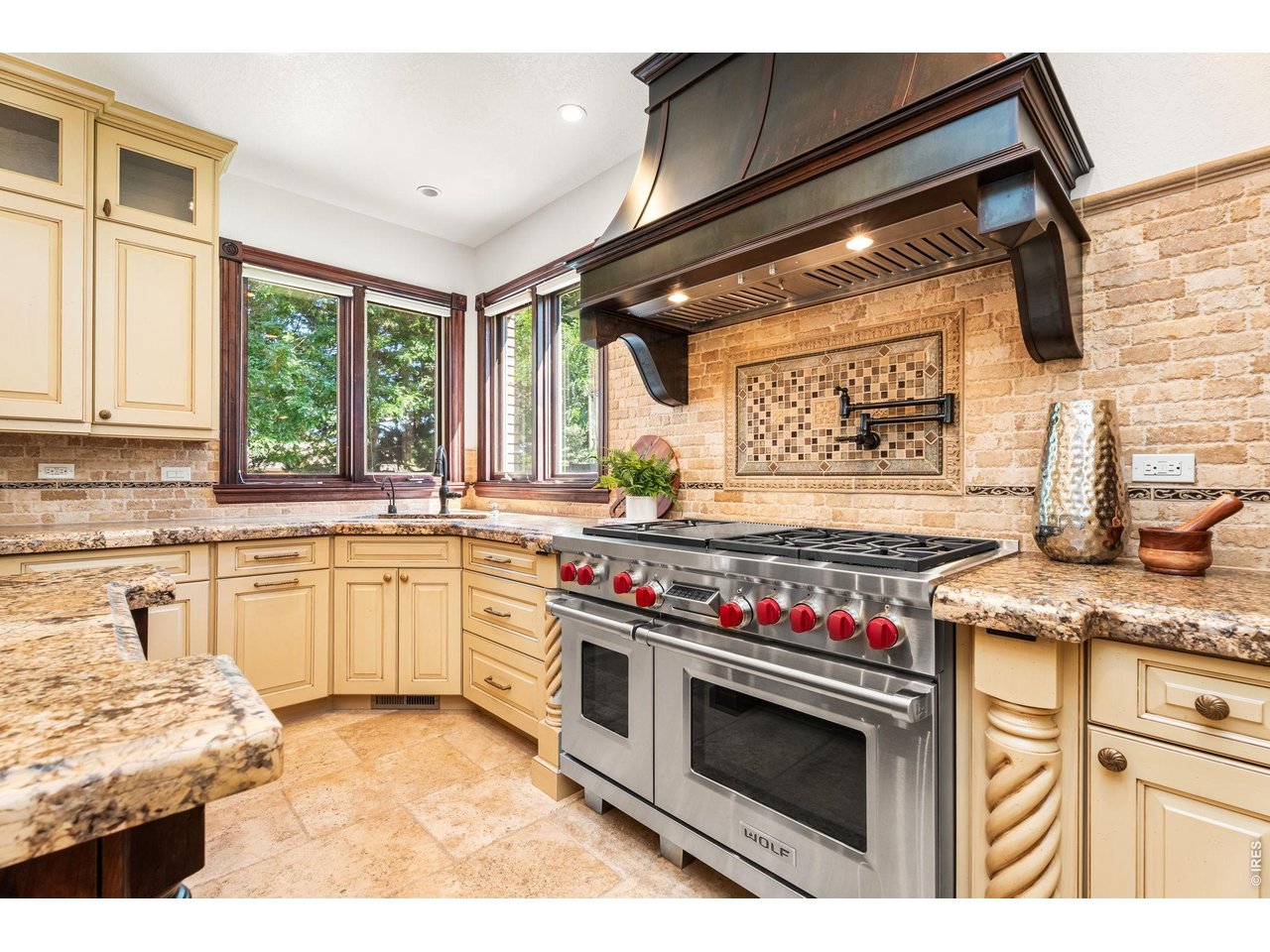 5100 Abbey Road Fort Collins, CO 80526 - Photo 19 of 49 a kitchen with stainless steel appliances granite countertop a stove and a sink