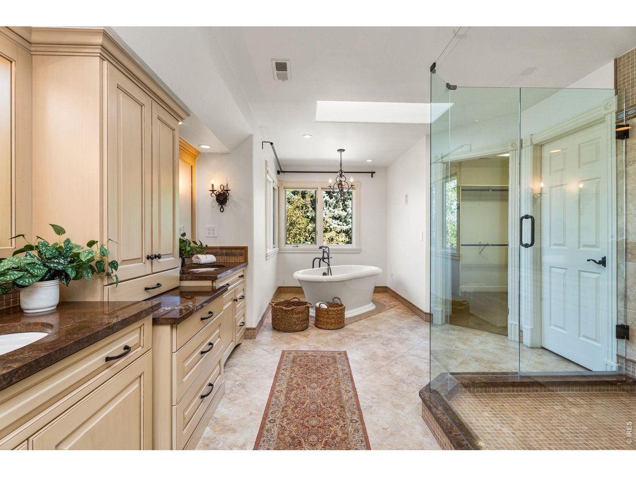 5100 Abbey Road Fort Collins, CO 80526 - Photo 27 of 49 a bathroom with a tub shower and sink