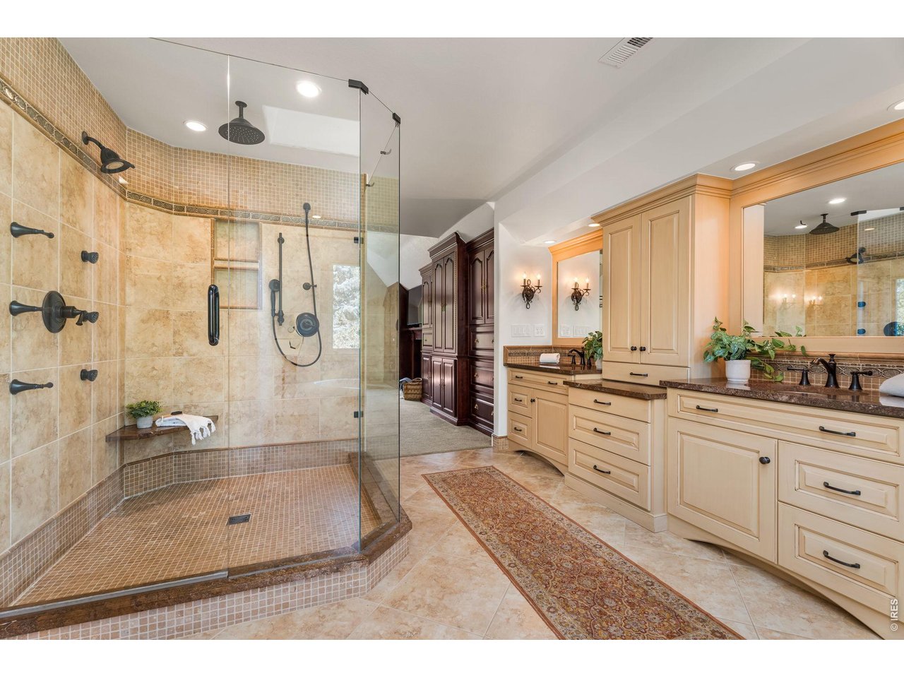 5100 Abbey Road Fort Collins, CO 80526 - Photo 28 of 49 a bathroom with a granite countertop sink mirror and a shower