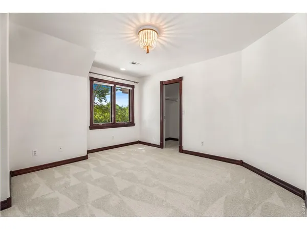 a bathroom with a granite countertop sink a mirror and a shower