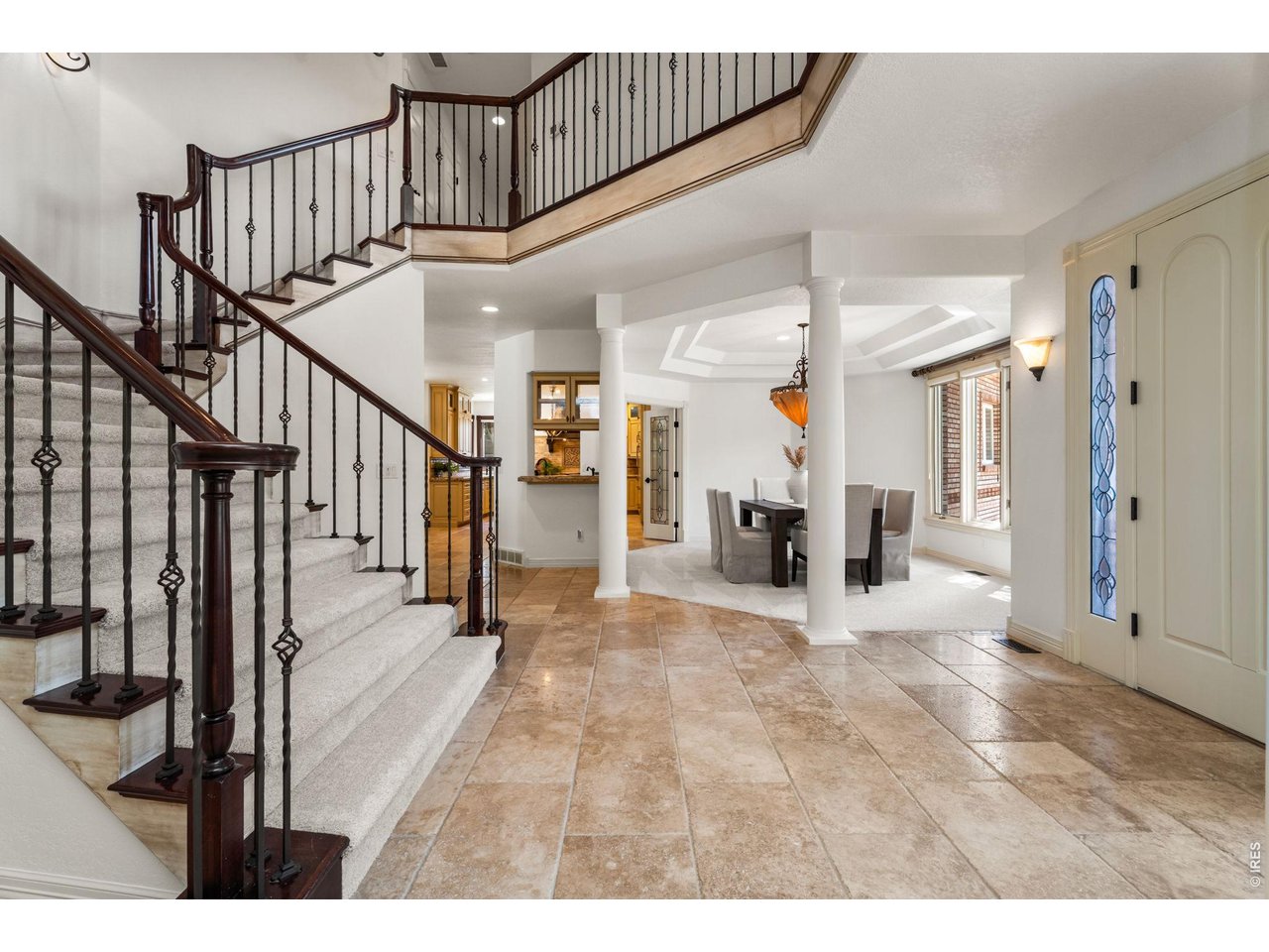 5100 Abbey Road Fort Collins, CO 80526 - Photo 6 of 49 a view of a living room and entryway with wooden floor