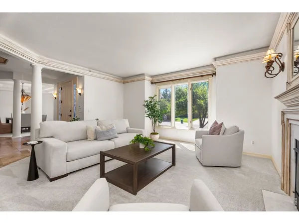 a living room with furniture and a dresser