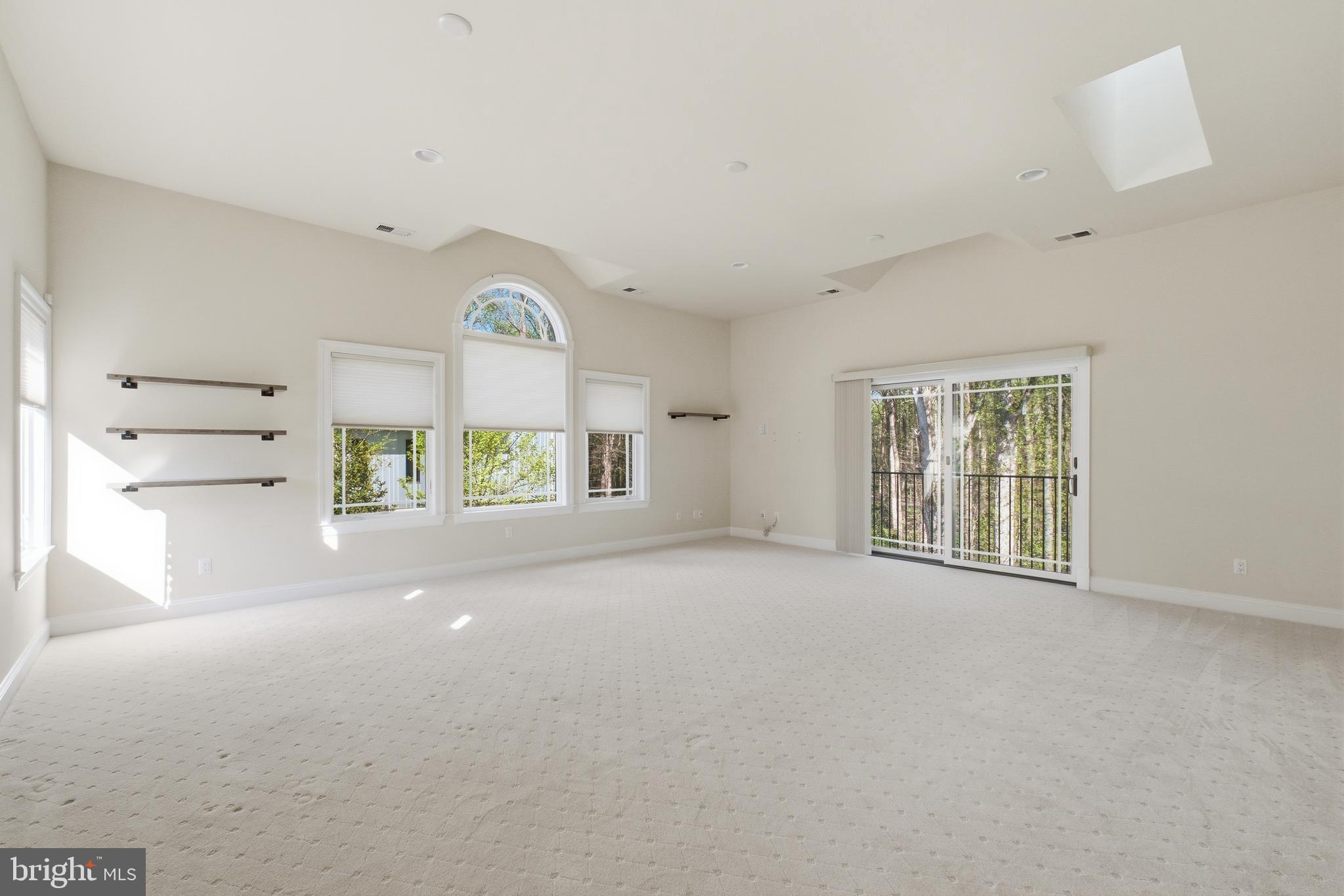 8735 Brook Road McLean, VA 22102 - Photo 17 of 20 a view of a livingroom with a ceiling fan and window