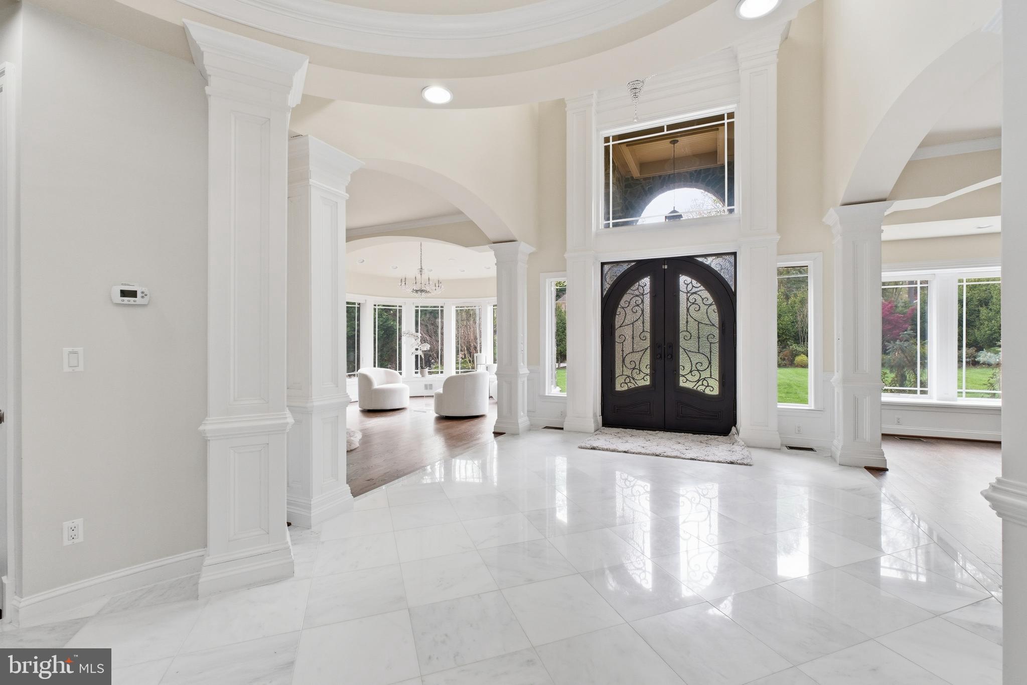 8735 Brook Road McLean, VA 22102 - Photo 4 of 20 a view of an entryway with wooden floor and a rug