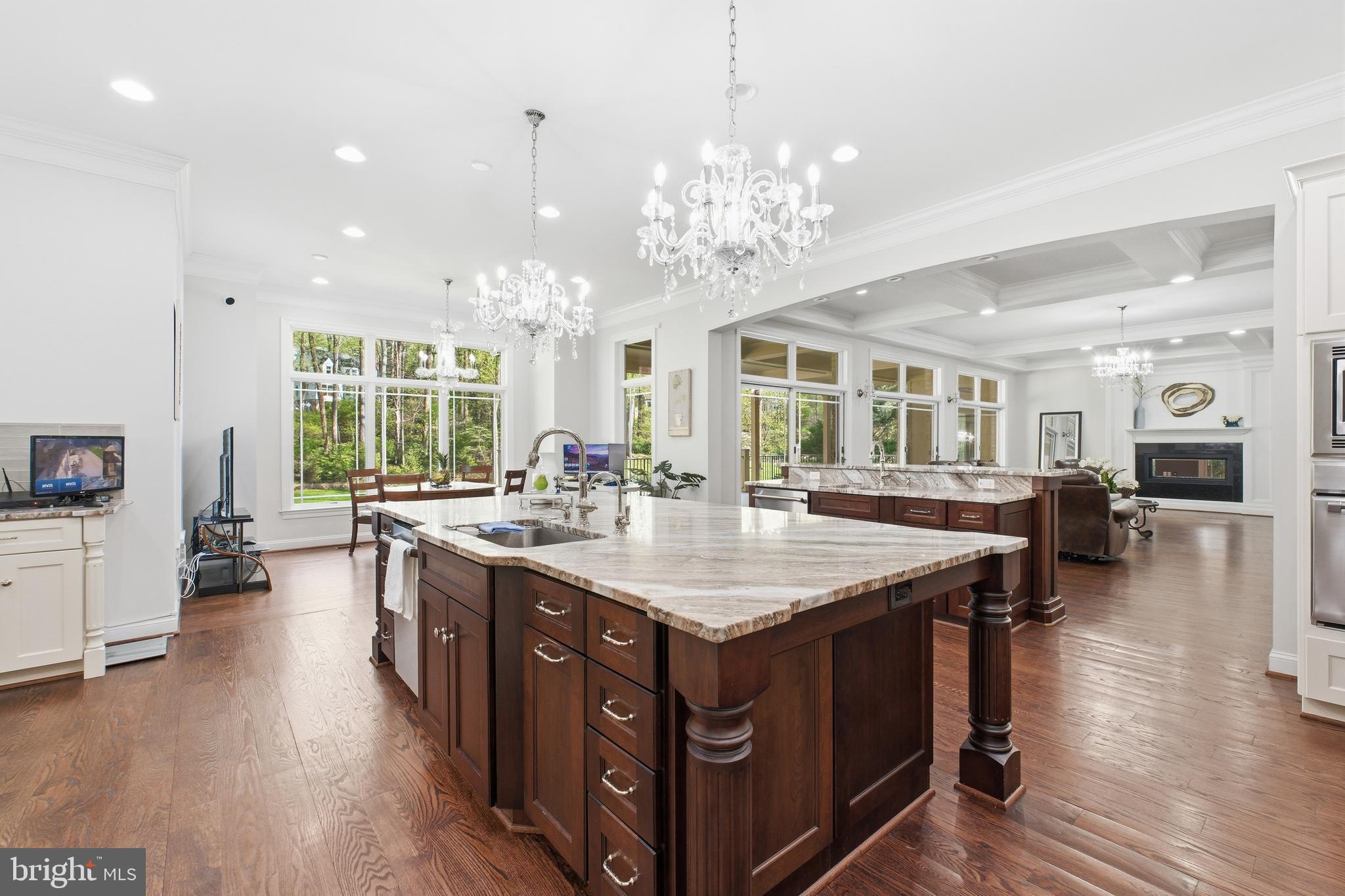 8735 Brook Road McLean, VA 22102 - Photo 10 of 20 a large kitchen with stainless steel appliances granite countertop a large center island and a stove