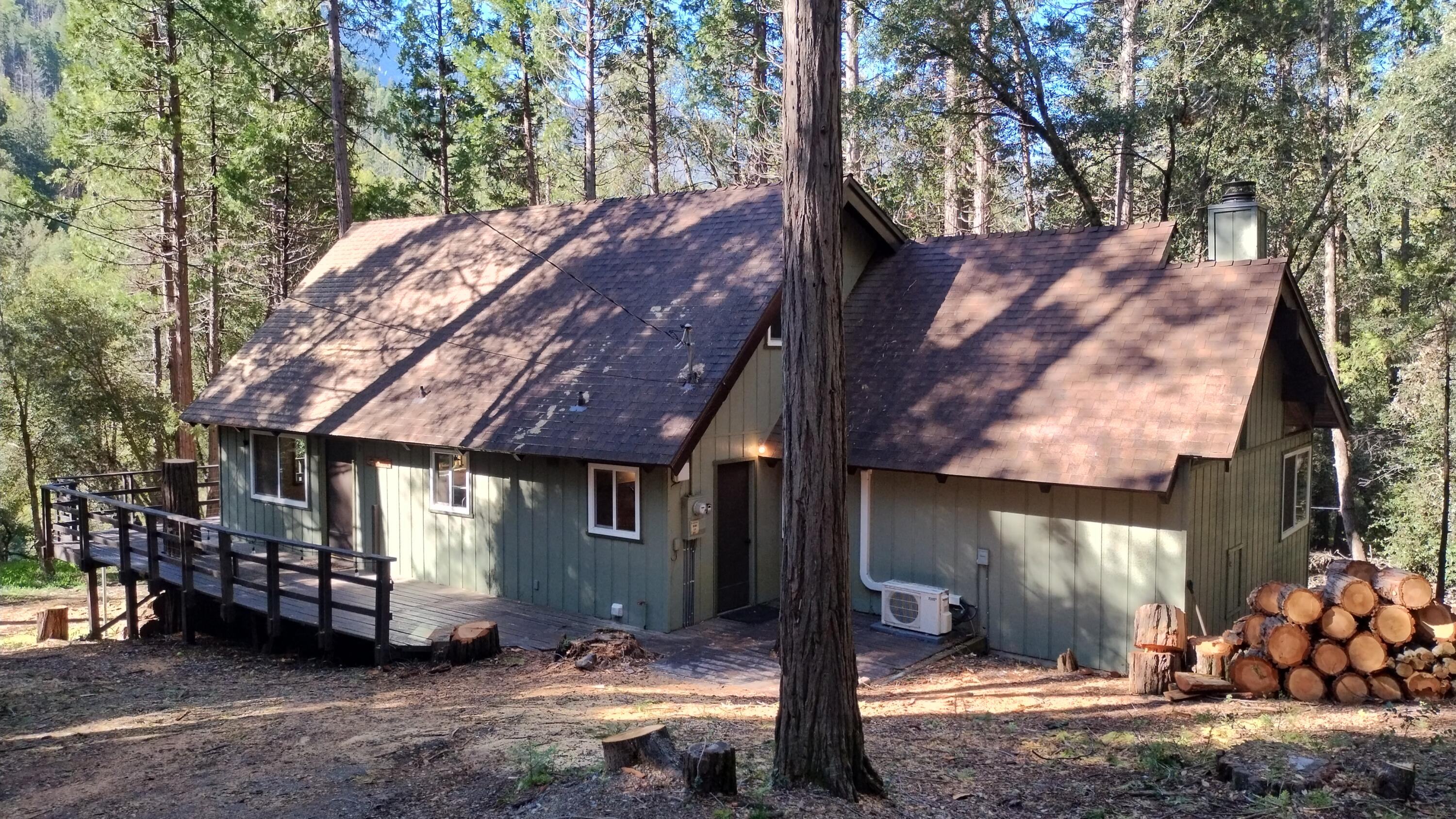 1693 Forest Rte 21S94 Camp Nelson, CA 93265 - Photo 2 of 86 a view of a house with a large tree and wooden fence