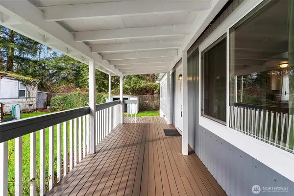 a view of a balcony with wooden floor