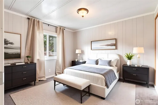 a bedroom with a bed and a window