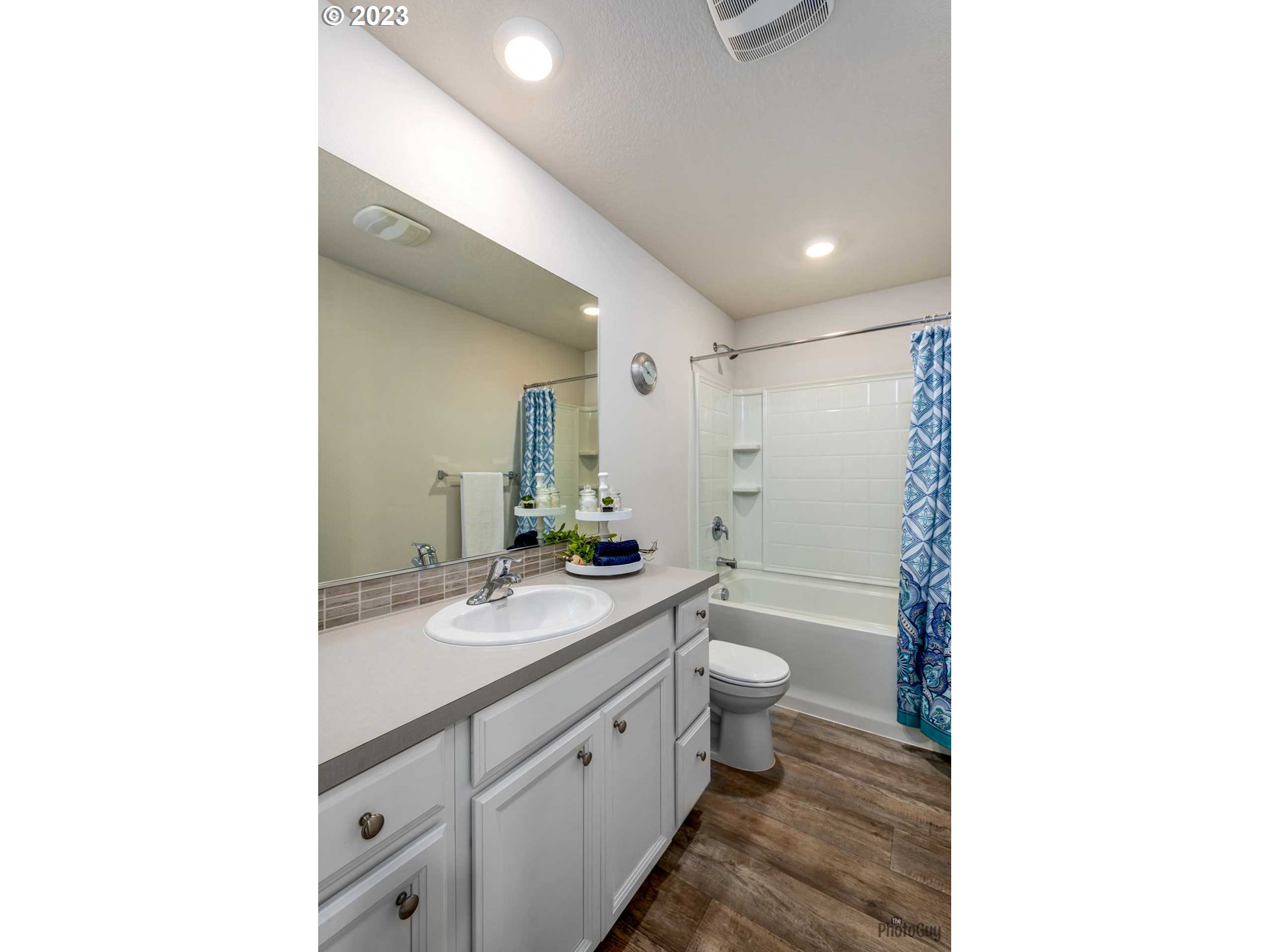 2942 W Street Springfield, OR 97477 - Photo 17 of 29 a bathroom with a double vanity sink toilet mirror and shower